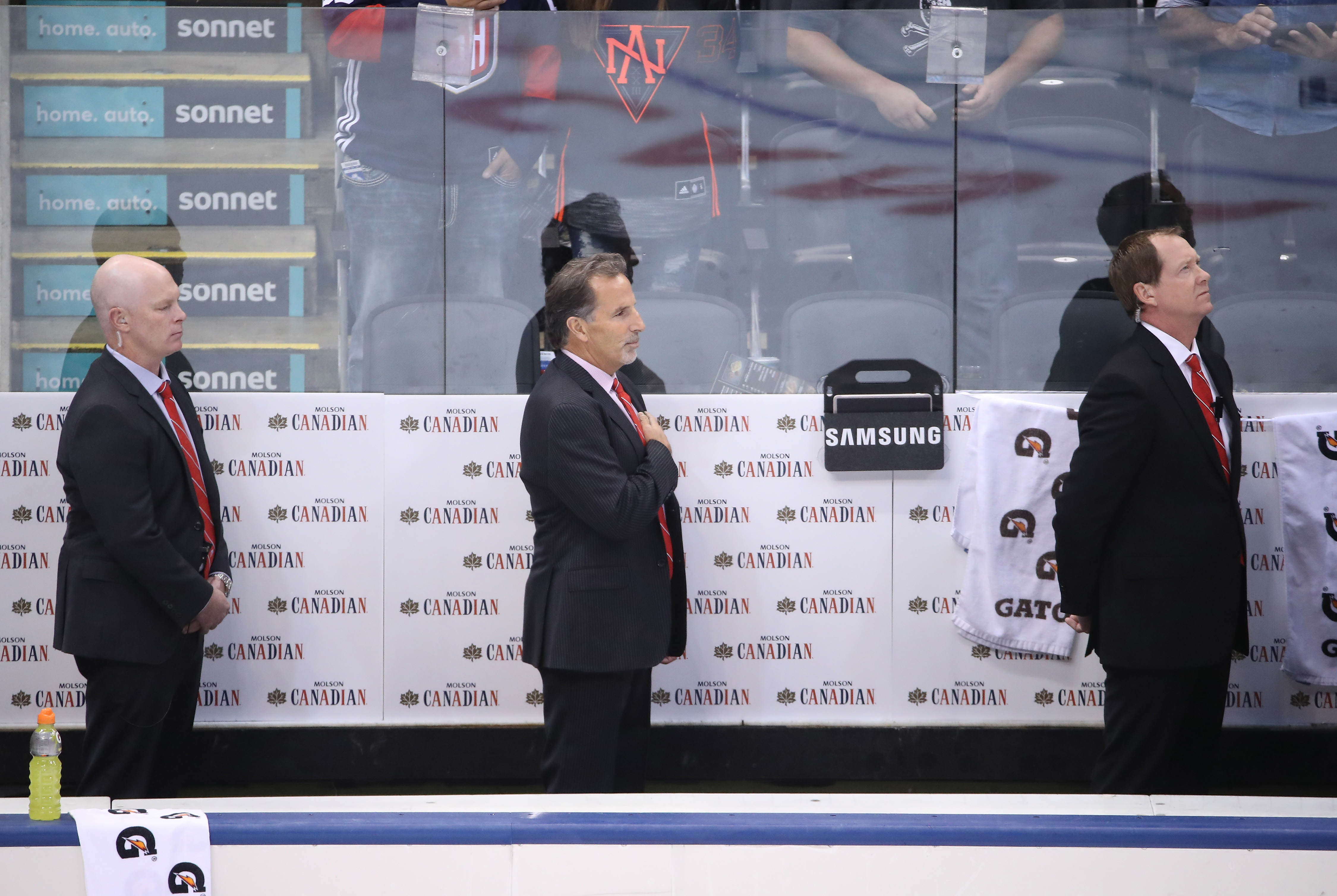 TORONTO, ON - SEPTEMBER 22: Assistant coach John Hynes of Team USA and head coach John Tortorella and assistant coach Phil Housley stand for the playing of the American national anthem before playing against Team Czech Republic during the World Cup of Hockey tournament at the Air Canada Centre on September 22, 2016 in Toronto, Canada. (Photo by Tom Szczerbowski/Getty Images)