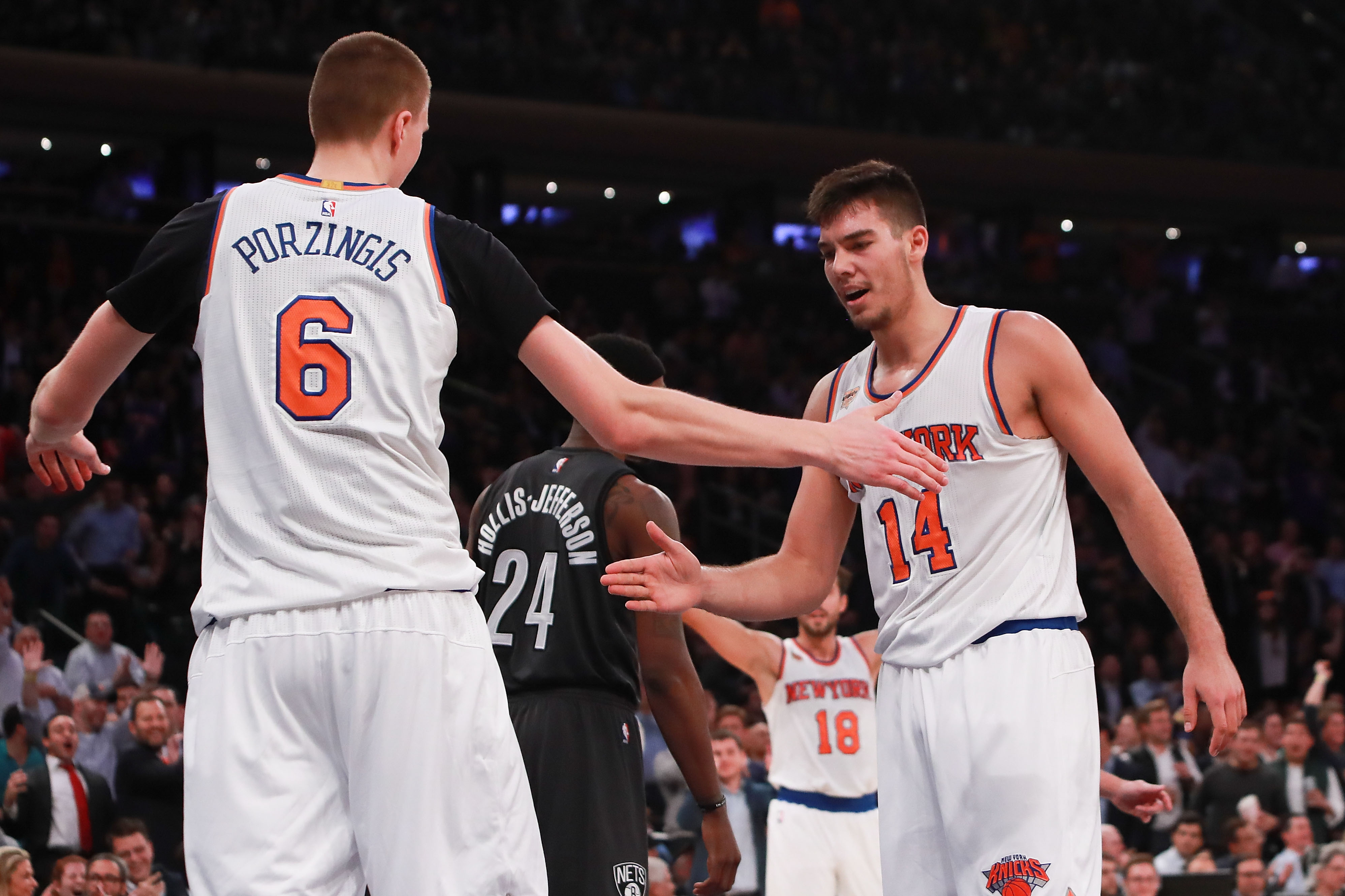 NEW YORK, NY - NOVEMBER 09: Kristaps Porzingis #6 and Willy Hernangomez #14 of the New York Knicks react against the Brooklyn Nets during the second half at Madison Square Garden on November 9, 2016 in New York City. NOTE TO USER: User expressly acknowledges and agrees that, by downloading and or using this photograph, User is consenting to the terms and conditions of the Getty Images License Agreement. (Photo by Michael Reaves/Getty Images)